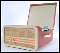 A fabulous mid Century two tone four speed portable record player by Phillips, speaker and dials