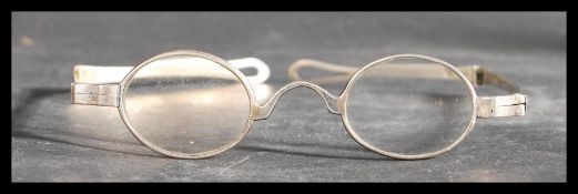 A pair of early 19th century Georgian silver folding spectacle wig glasses. Fully hallmarked