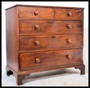 A Georgian 19th century mahogany chest of drawers having knob handles with a 2 short over 3 deep