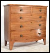 A 19th century mahogany bow front chest of drawers being raised on bracket feet with 2 short over