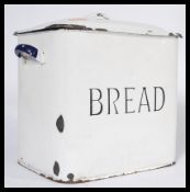 An early 20th century white enamel bread bid with lid and central notation together with a '