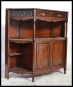 An Edwardian mahogany chiffonier bookcase base being raised on turned legs having open shelves