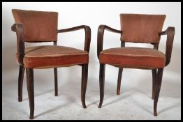A pair of original 1930's French Art Deco bridge chairs / armchairs. Raised on saber tapered
