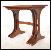 A G-Plan retro teak wood 1970's graduating nest of tables. The tables having angular legs united