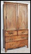 A 19th century Georgian mahogany linen press of sm