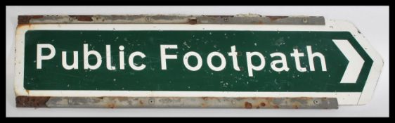 A 20th Century metal direction sign, on green ground with white lettering reading Public Footpath.