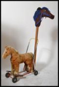 A fantastic retro 20th Century circa 1970's Hobby Horse together with a push along / ride on horse