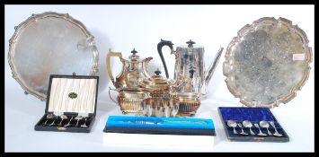 A collection of silver plated items to include salver trays, coffee pot, tea service, presentation