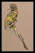 A sterling silver plique a jour brooch in the form of a parrot. Weighs 9 grams.