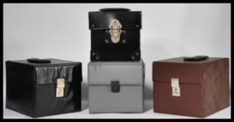 A group of four retro / vintage vinyl record storage cases. The cases for 7