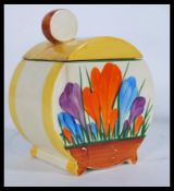 An early 20th century Clarice Cliff Bizarre Bonjour shape lidded condiment pot hand painted in the