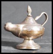 An early 20th century Edwardian hallmarked silver table lighter in the form of an oil lamp / Aladdin