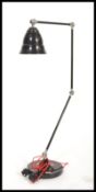 A large vintage retro floor standing anglepoise lamp having a black enamel finish with red enamel
