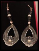 A pair of floral drop earrings set with freshwater pearls. In presentation box.