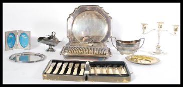 A collection of silver plate to include trays , cased set of cutlery , tureen , three sconce
