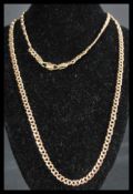 A hallmarked 9ct gold curb chain necklace having a lobster claw clasp. Measures 22 inches. Weight