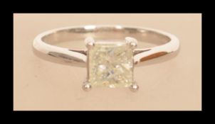 An 18ct white gold diamond ring having a Princess cut diamond in prong setting. Size N weighs 3.1