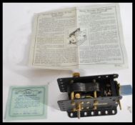 A vintage boxed Meccano electric motor e20r 20 volt appearing complete and unused in original box.