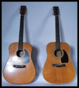 Two 20th Century acoustic six string guitars to include a Hondo II and a Hohner  both with applied