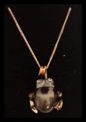 An unusual 14ct white gold south sea pearl and diamond frog shaped pendant necklace complete in