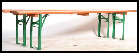 A pair of mid 20th Century Industrial factory work benches. Each of panelled wood with folding metal