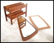 A retro 20th Century  Danish teak wood retro magazine rack - canterbury by Guy Rogers. The