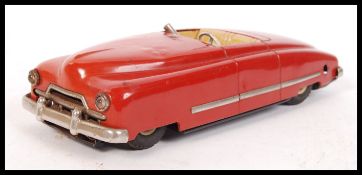 A retro vintage German Arnold Spielwaren tin plate wind up toy automobile JNF Favorit. Condition