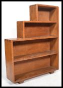 A 1930's Art Deco oak step bookcase. Solid oak wit