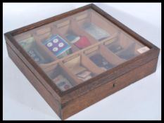 A vintage mid 20th Century haberdashery counter top point of sale silks / cottons cabinet, fitted