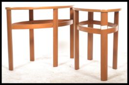 A pair of mid century Lozenge shaped side tables by Nathan. Each on corner supports united by