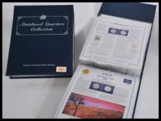A complete collection of American Statehood Quarters contained within two collectors folders