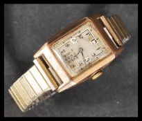A vintage early 20th century 9ct Tank Style art deco watch having a silvered dial with arabic