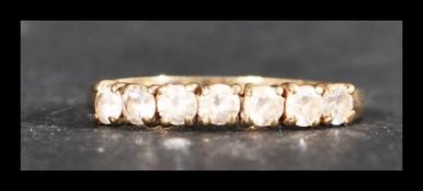 A hallmarked 9ct gold 7 stone ring set with 7 white stones. Hallmarked Birmingham. Weight 1.4g. Size