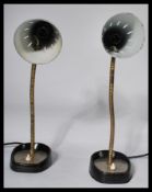 A pair of vintage mid 20th Century Pifco goose-neck desk / bedside lamps, ebonised fitted conical