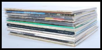 A good collection of vinyl long play LP album records featuring several artists to include Elton