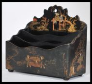 An early 20th century Japanese letter rack stationary tidy depicting figures with trees and
