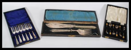 A cased set of silver hallmarked coffee bean spoons along with a cased set of fish servers AF and