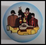 A prototype dressing table pot of the Beatles being marked to underside for Lasday Thailand Send