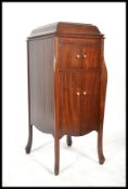 An early 20th Century mahogany cased floor standing HMV Gramaphone raised on cabriole legs,