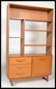 A 1970's / mid century Schreiber room divider / upright bookcase having tapering legs with