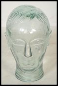 A unusual small 20th century moulded pressed glass phrenology type head shop display stand /