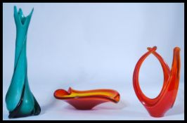 A group of three pieces of studio glass to include a blue twist vase, a shallow bowl and another