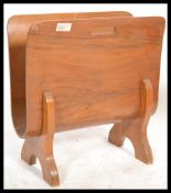 A mid century bentwood retro magazine rack canterbury. The bentwood panel with shaped supports to