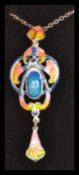 A sterling silver and enamel set necklace pendant in the manner of Charles Horner in presentation