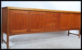 A stunning vintage / retro 20th Century teak wood 7 foot sideboard by Nathan. The central bank of