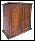 A Victorian walnut 19th century table top specimin cabinet. The chevron panel doors housing a bank