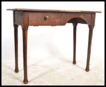 A 1930's Air Ministry George V stamped writing table desk being raised on turned tapering legs