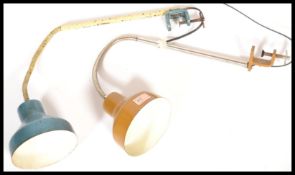 A pair of Scandinavian mid Century vintage industrial workmens table / bench clamp lamps both having