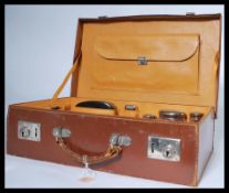 A fantastic gents vanity travelling suitcase / case fully appointed having various white metal