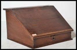 A 19th Century Victorian desktop Clerks desk having a hinged lid and appointed interior.